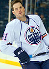 https://upload.wikimedia.org/wikipedia/commons/thumb/c/c8/Mike_Comrie_in_2009.jpg/100px-Mike_Comrie_in_2009.jpg